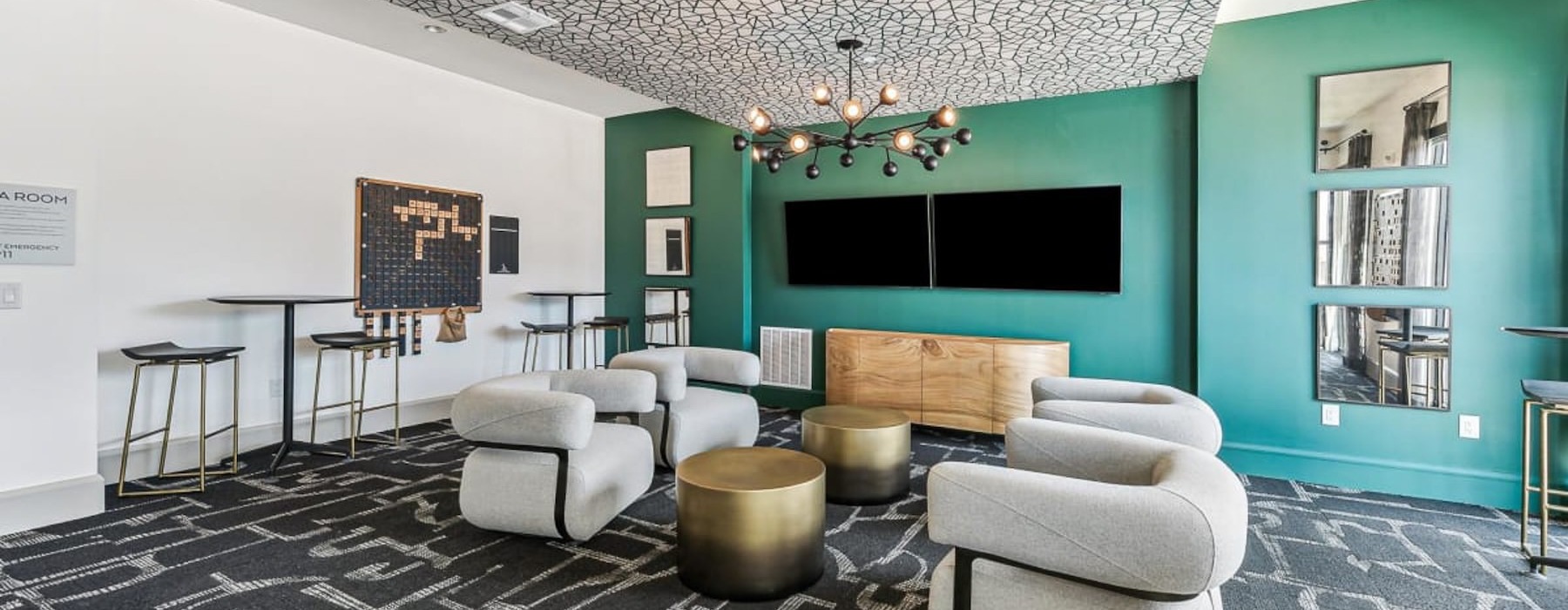 a clubhouse room with a couch and chairs