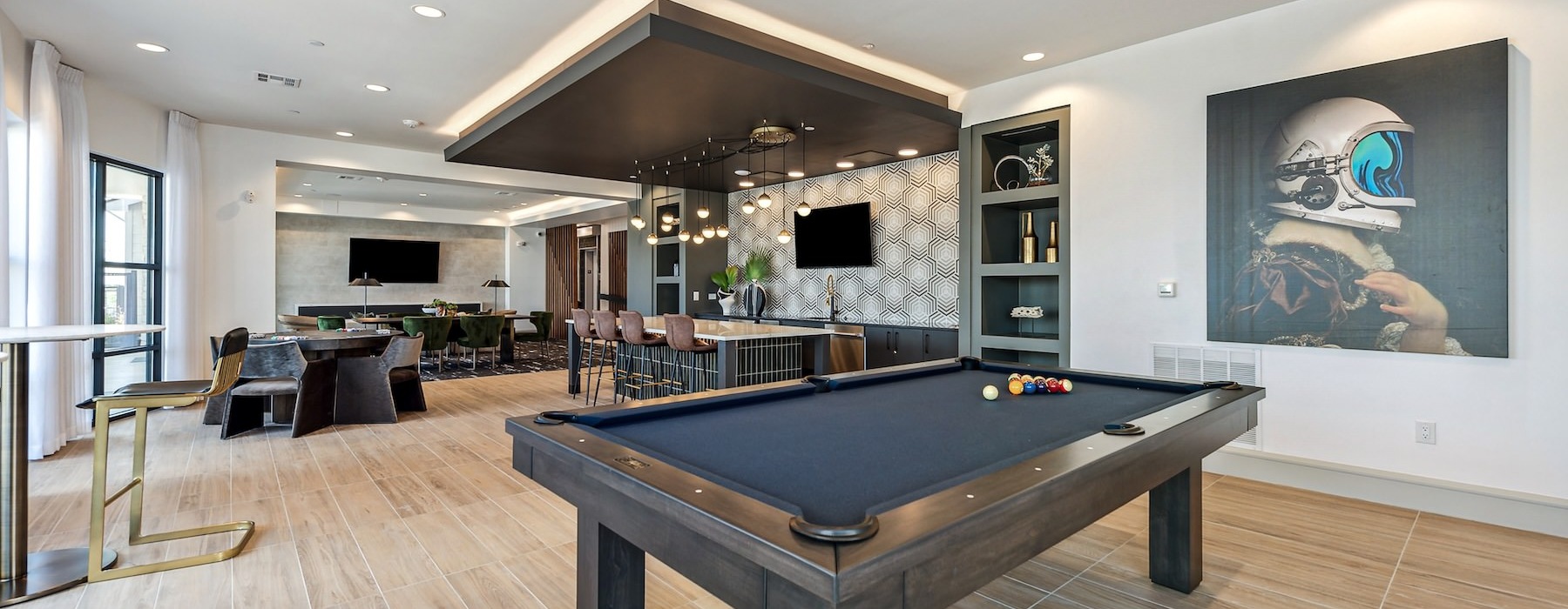 a pool table in a clubhouse room