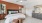 a bedroom with a bed and a fan