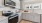 a kitchen with grey cabinets